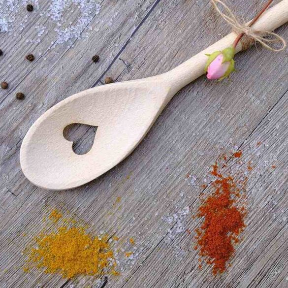 wooden spoon with a heart cut in the middle