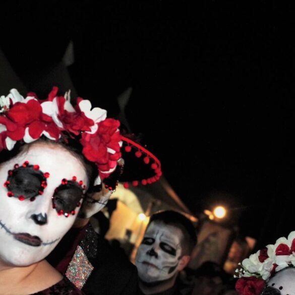The Day of the Dead celebrators in costumes