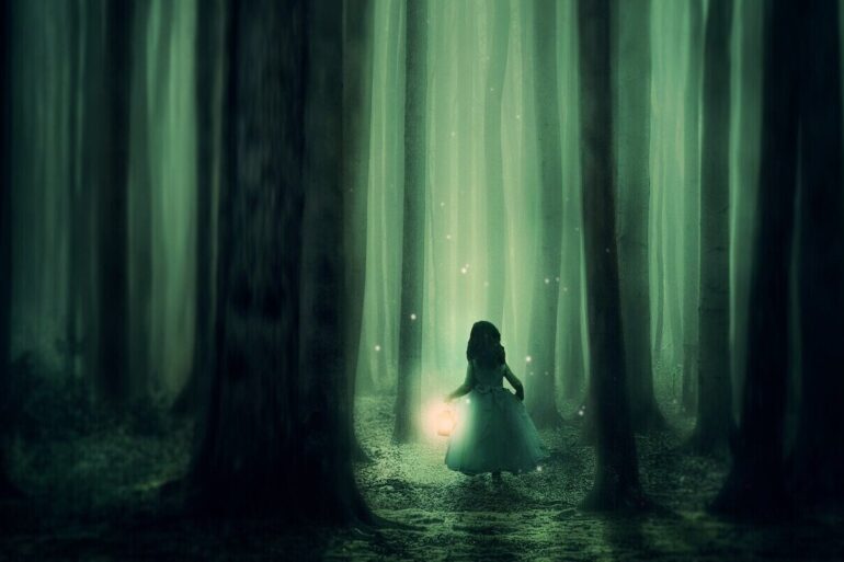 girl with light in the woods