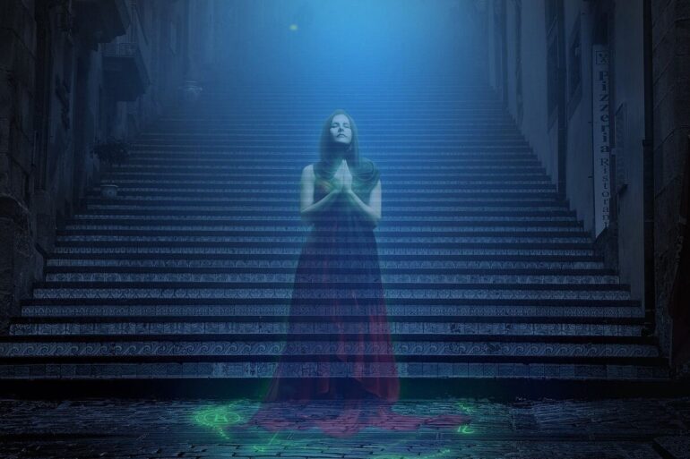 wraith of a woman in front of stairs