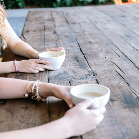 two women drinking tea