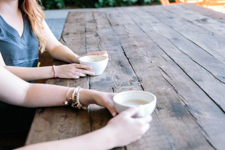 two women drinking tea