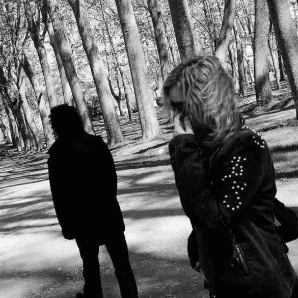 Two angry, sullen people on path