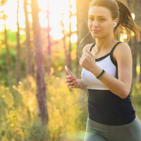Woman running with headphones on
