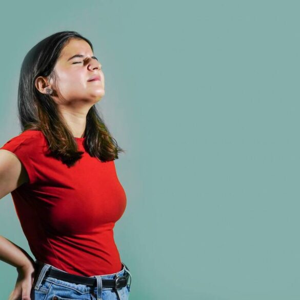 Young woman with back pain