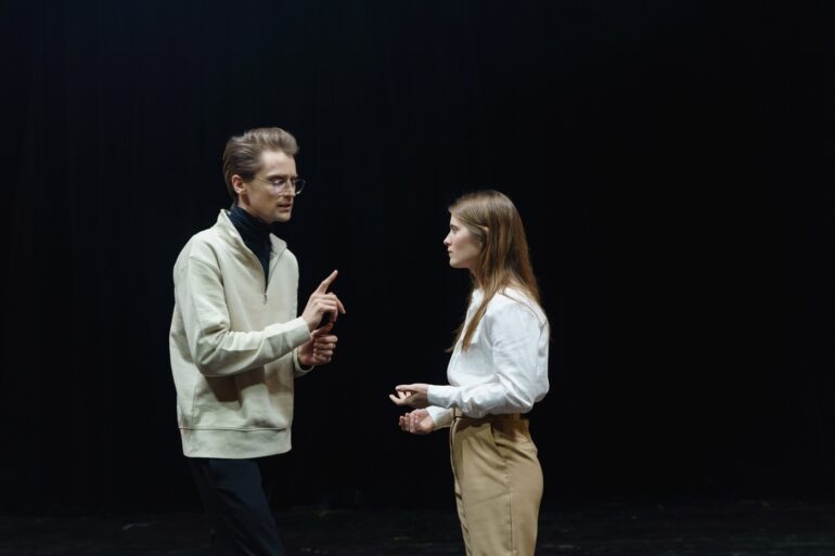 man and woman on a stage