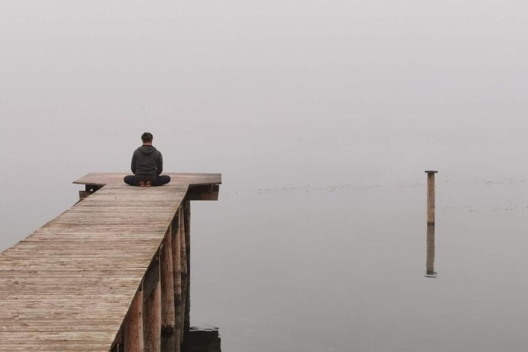 THE TIMELESS MOMENT: 2 dialogues and a poem about thoughts, existence and death 15 Man meditating on dock by lake