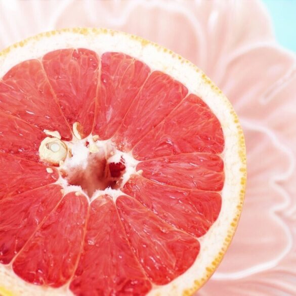 half a grapefruit with a seed