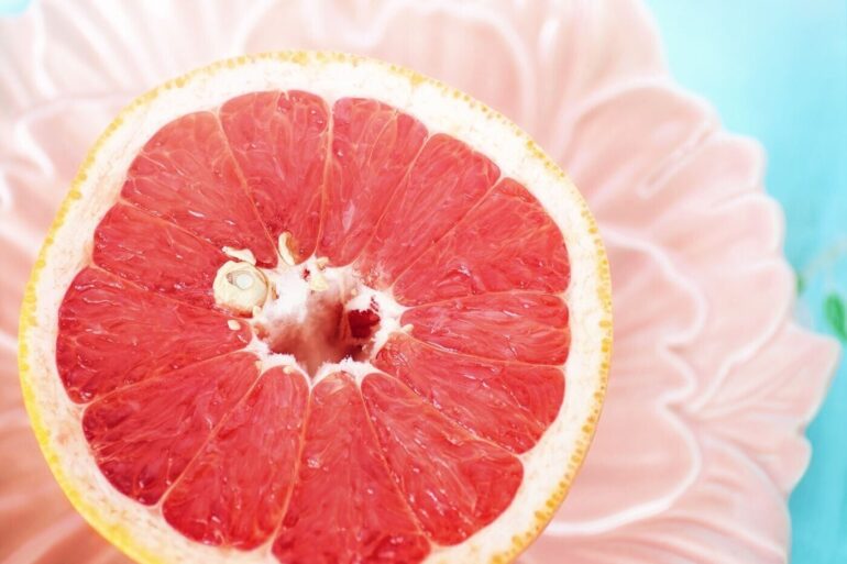 half a grapefruit with a seed