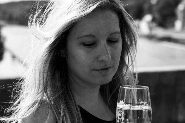 Young woman drinking wine