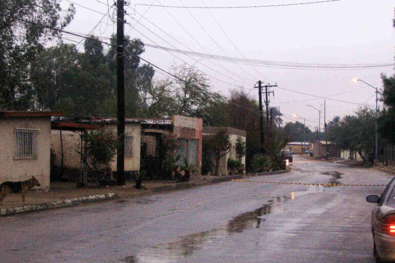 Car driving down street in Mexican town