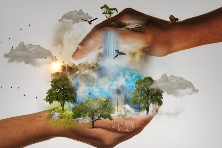Two hands protecting trees and the environment