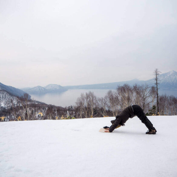Downward dog pose in snow
