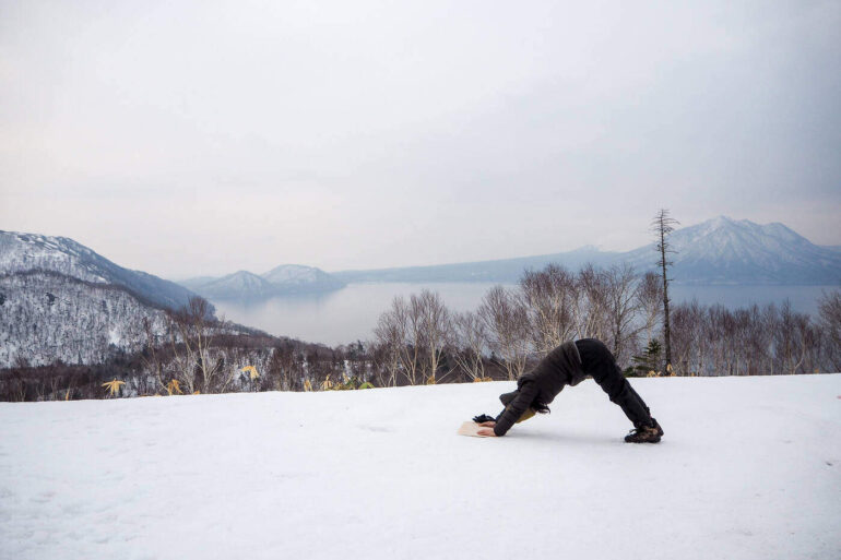Downward dog pose in snow