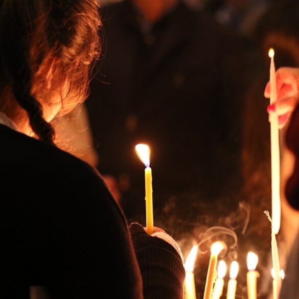 woman lighting candles