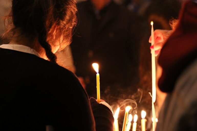 woman lighting candles