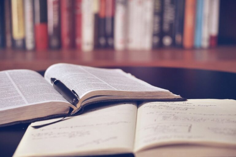 Two open books in library
