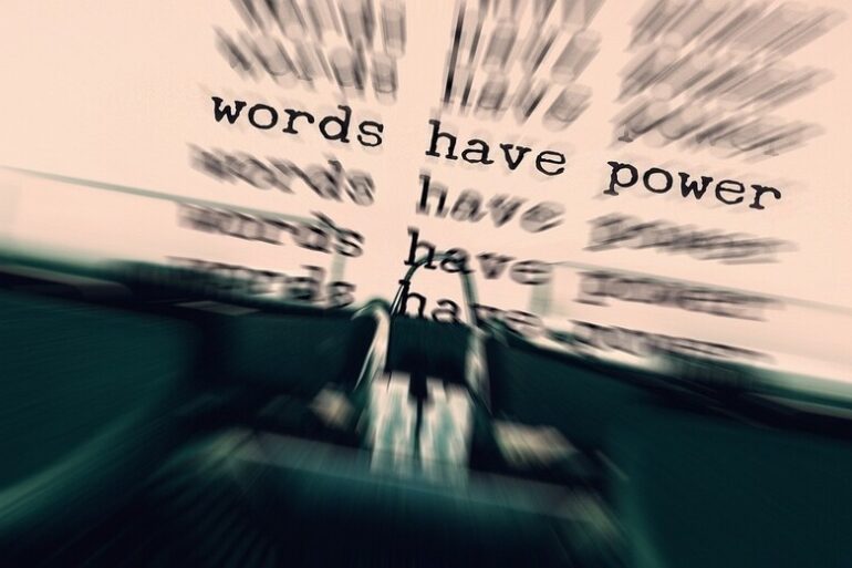 "Words have power" being typed on typewriter