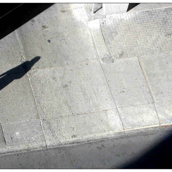 Shadow of a woman on a pavement