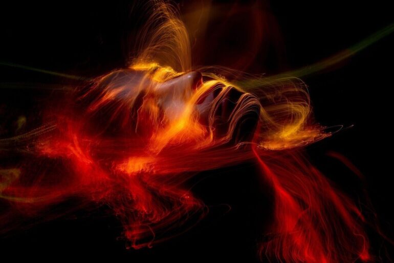 Woman face made out of flames