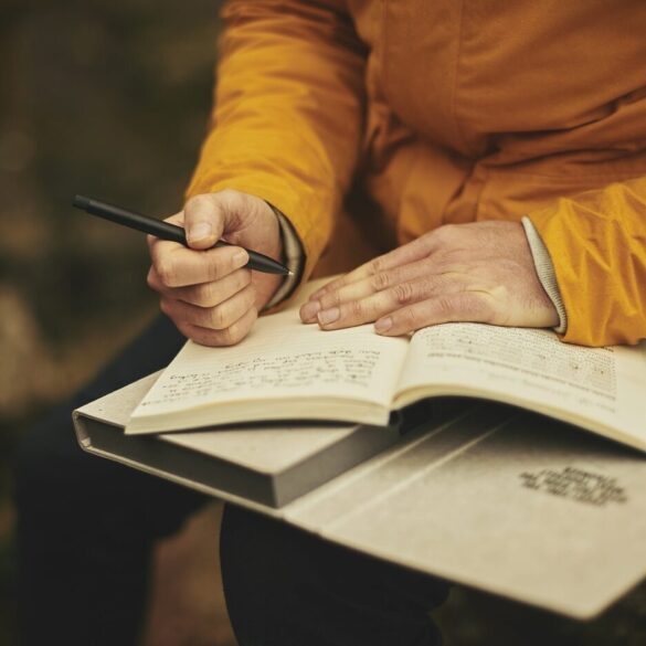 Adult journaling outdoors