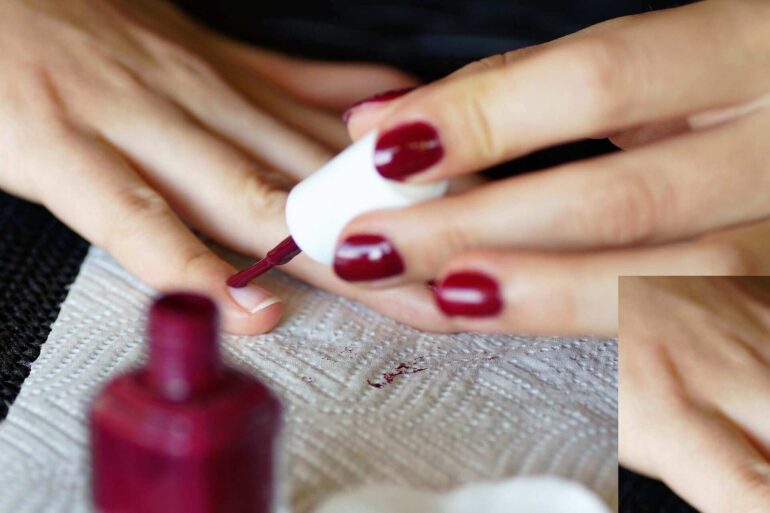 hands removing nail polish