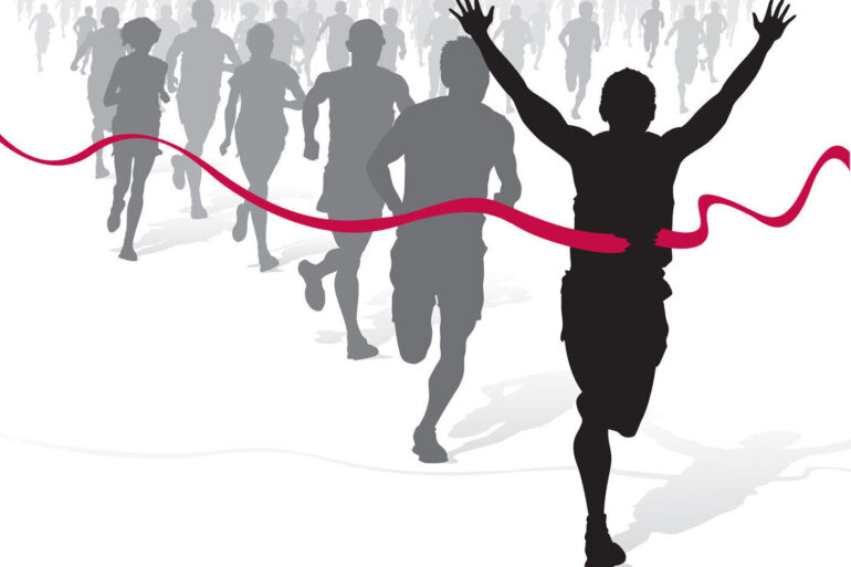 Silhouettes of people in running race