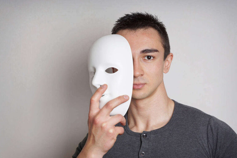 Man removing plaster mask
