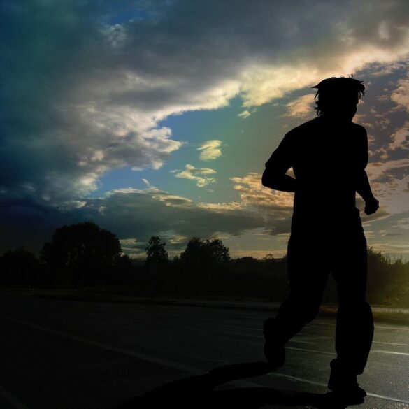 Silhouette of man running outdoors