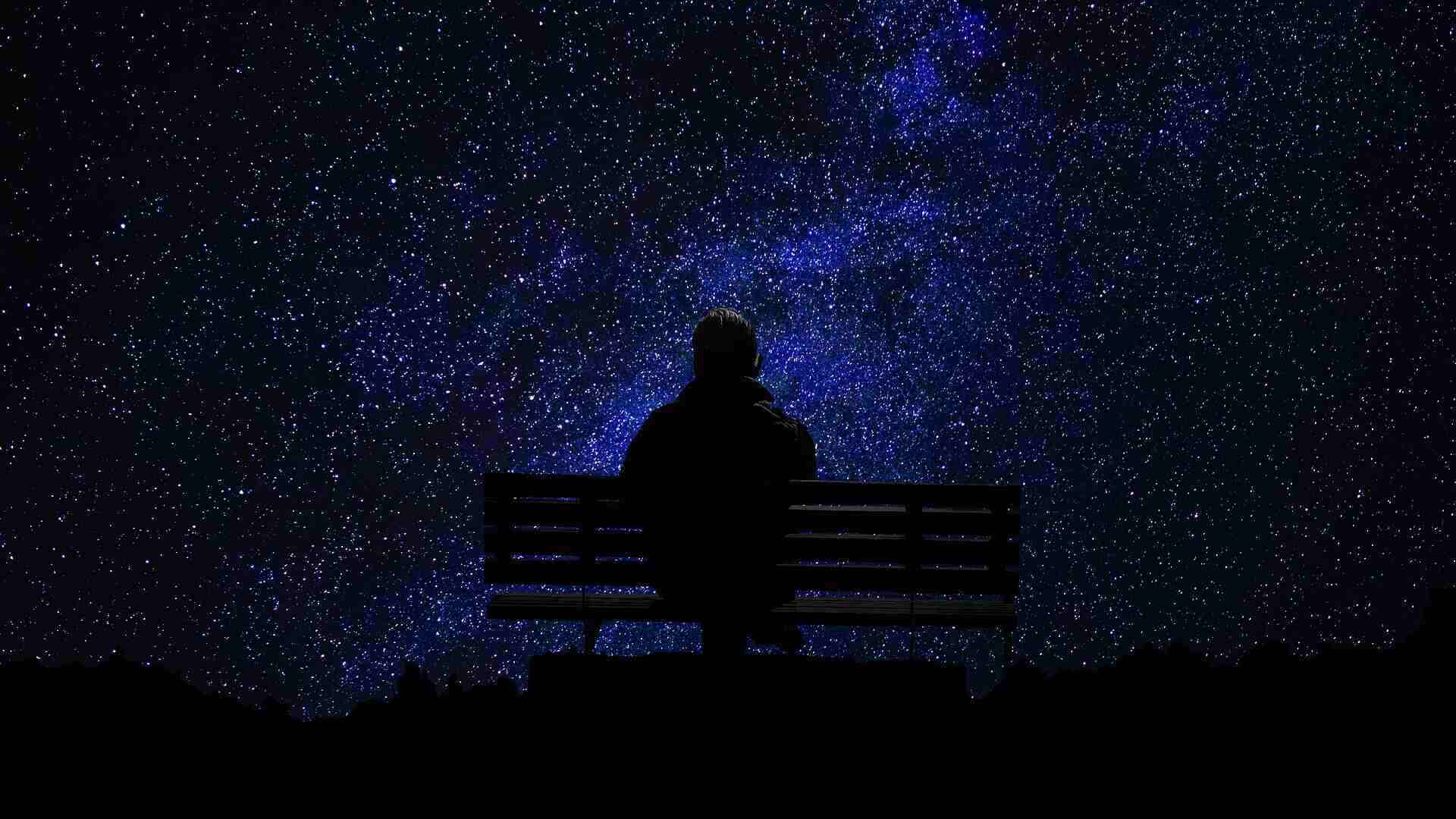 THE CRUX OF MY HEALING: Not found in the space of awareness, but awareness itself 13 man sitting alone on a park bench looking at the night sky