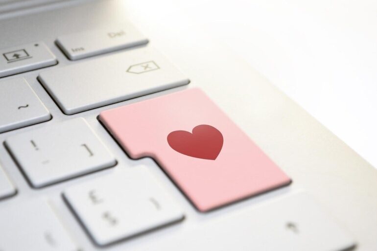 Laptop keyboard with heart as enter key