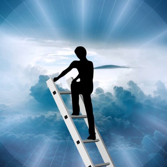 Silhouette of person climbing ladder into sky