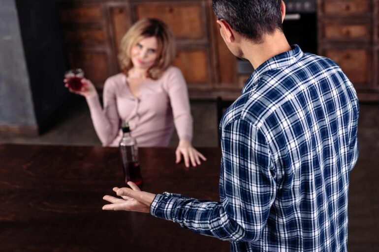Man annoying with drunk wife