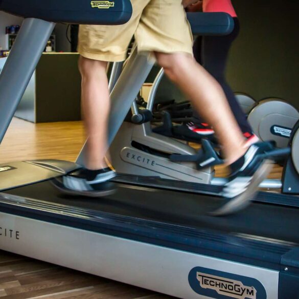 Man's legs running on treadmill