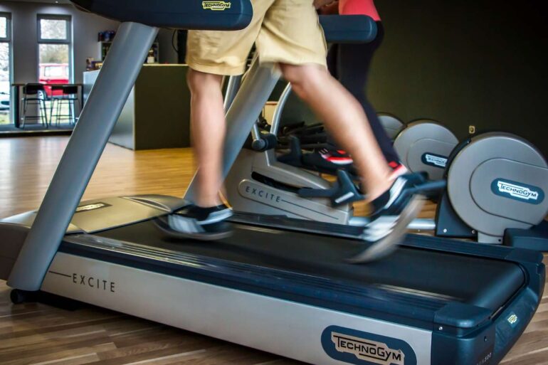 Man's legs running on treadmill