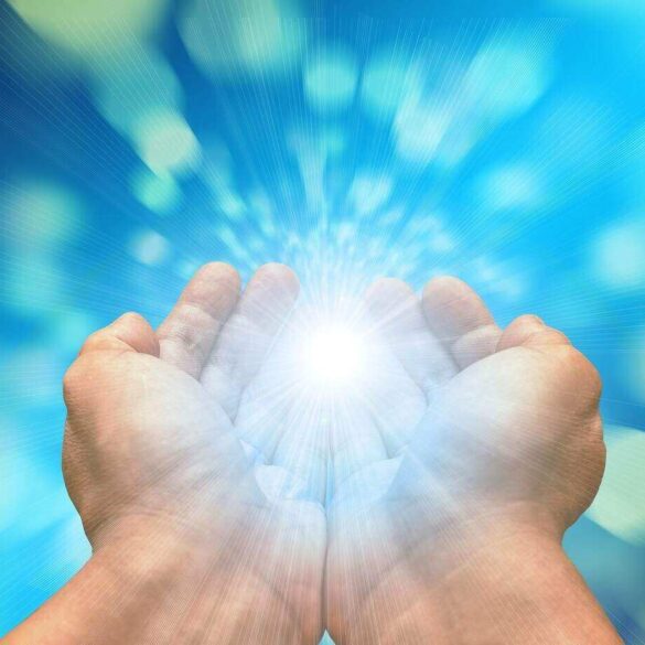 two hands holding a light