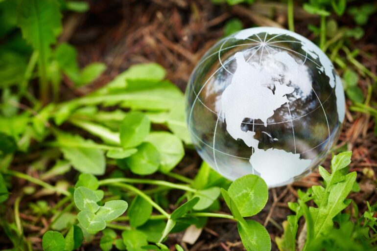 Transparent Earth sitting on ground