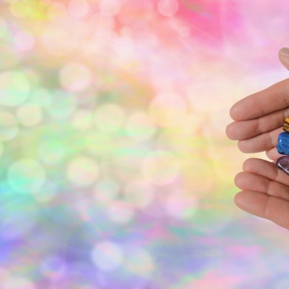 Hands holding bunch of crystals for healing