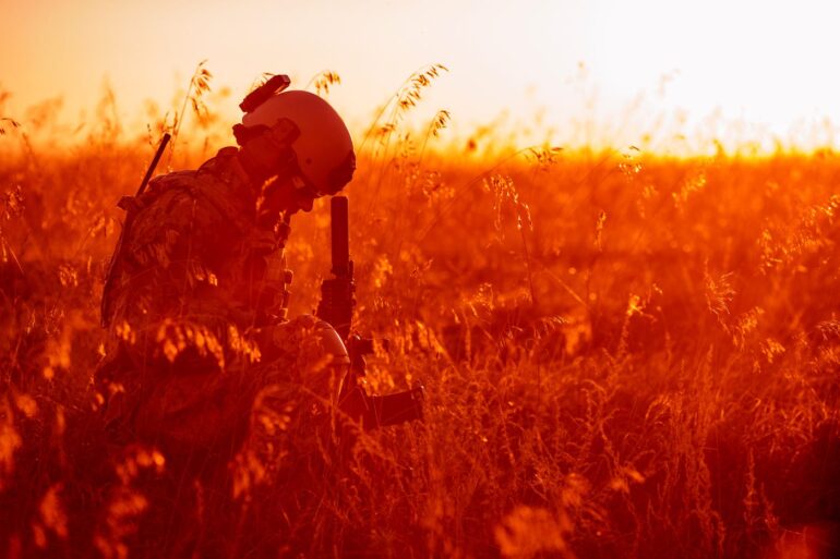 American soldier in field - 6 meditation practices for veterans to explore