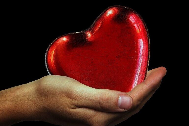 Hand holding a heart shape