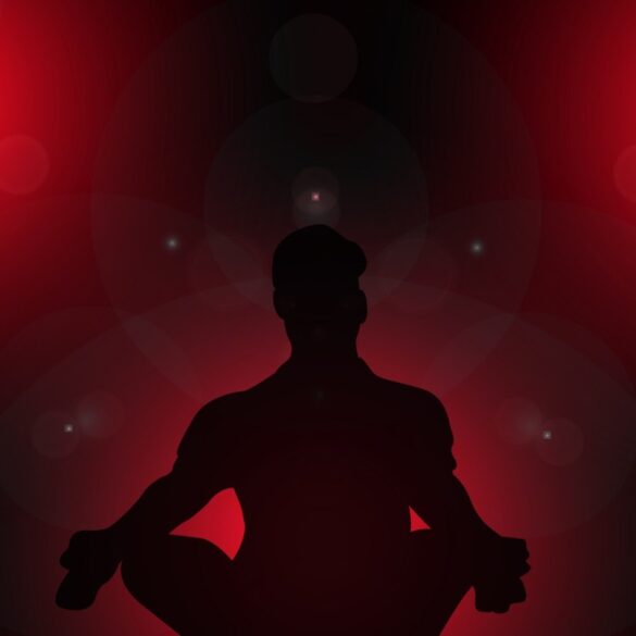 Silhouette of person meditating against red background