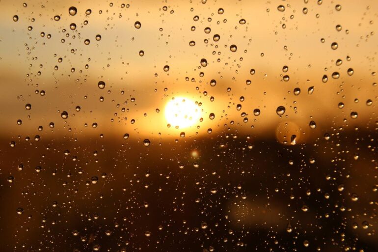 Rain-covered window with sun peeking through - 3 Poems, Including "We Are the Sky" and "The Door to My Mind"