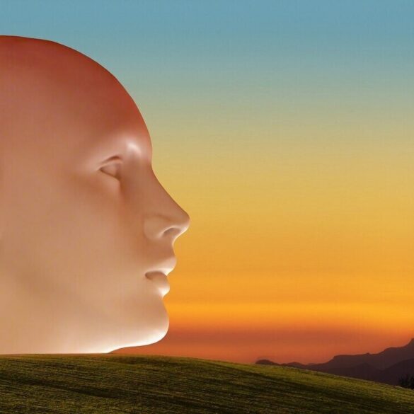 sculpture of a face looking across a landscape - Understanding American Democracy, With Help From Adyashanti