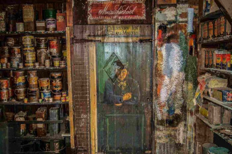 old museum with an old woman looking through the door