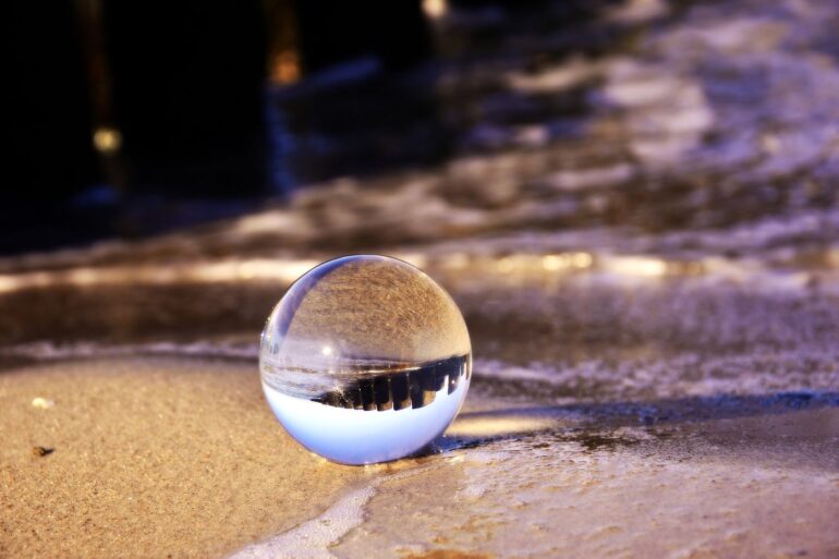 Transparent bubble on beach showing reflection of beach - 4 Poems About Spiritual Possibility, Including ”What We Want”
