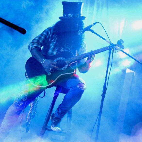 rock musician on stage playing guitar - Staying in the Middle of the Road by Living With Temperance