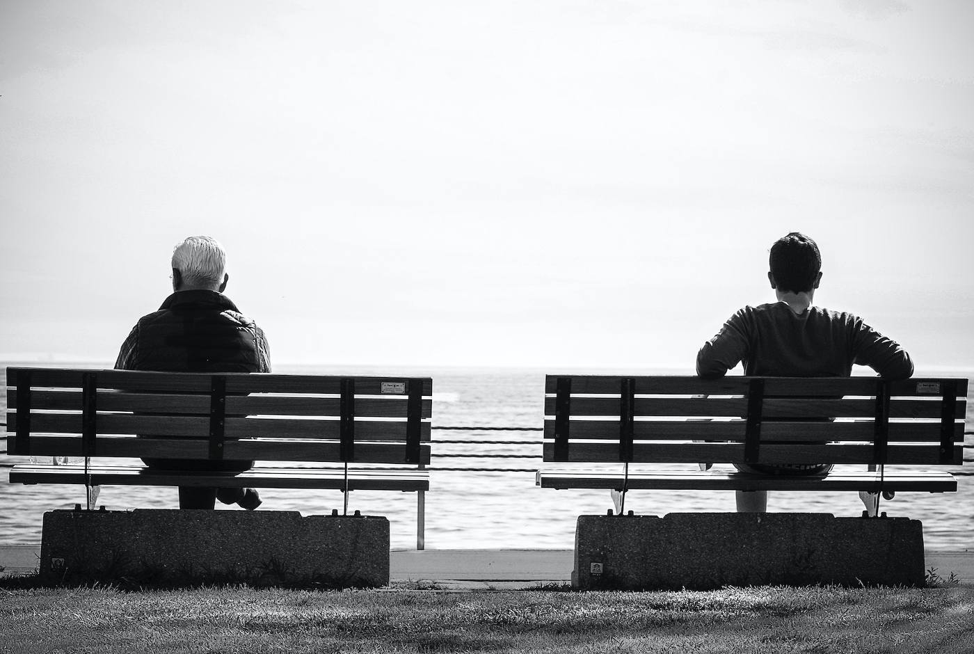 A RETURN TO WHO WE ARE: The value of learning to pause and reflect 13 Black and white photo of two men sitting on benches - The Value of Pausing and Reflecting in the Present Moment