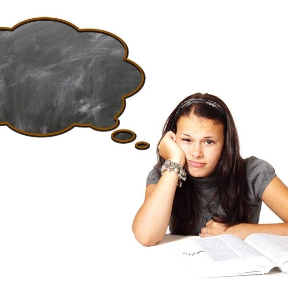 bored schoolgirl staring into distance - Stoics and Boredom: The Emotional Benefits of Quiet Times