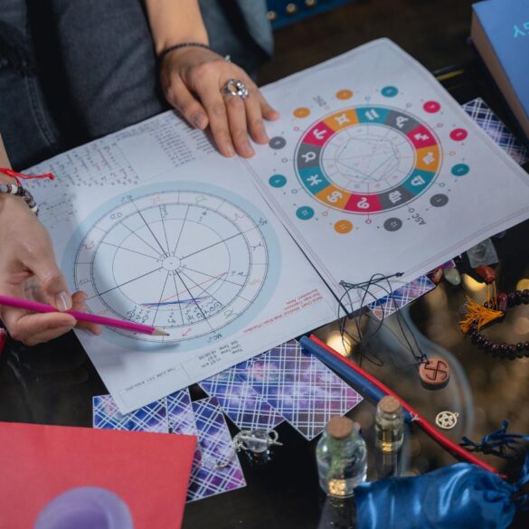 Female astrologer working with charts - 5 Misconceptions About Astrology and the Cosmic Connection