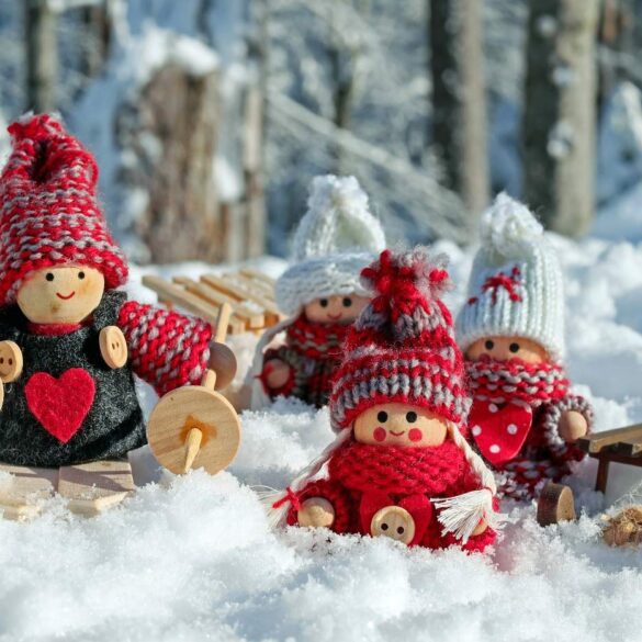 Family of Christmas doll figures outside in snow - Solo Strength: A Parent's Guide to Navigating the Holidays